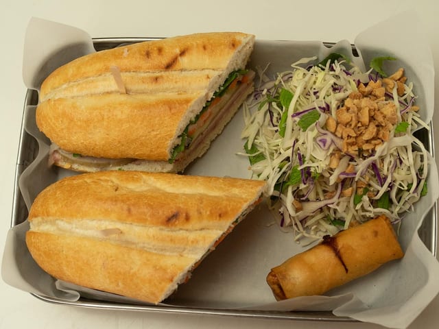 Box Lunch - Sandwich, Egg Roll & Salad.